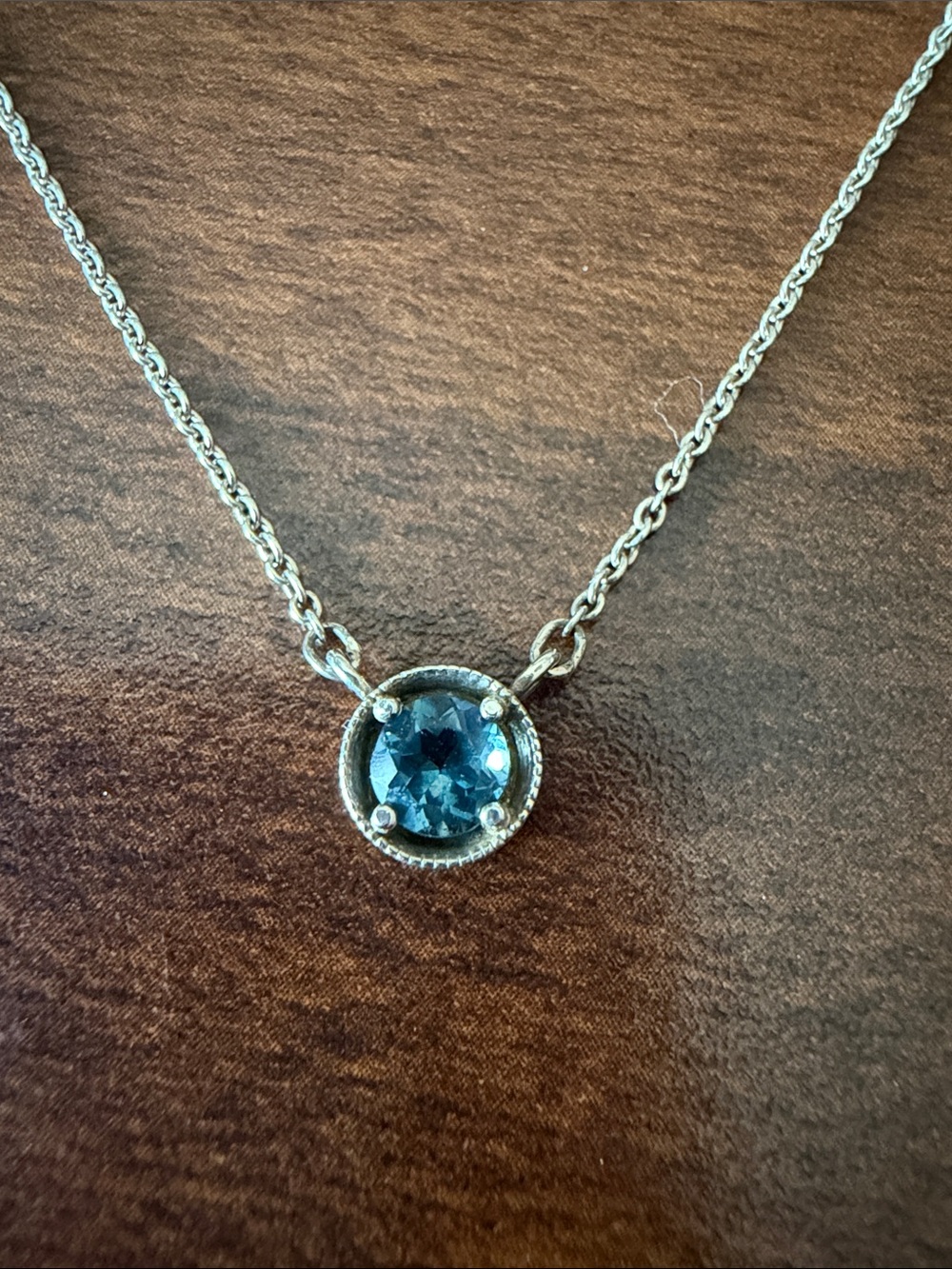 925 sterling silver minimalist necklace with blue / teal sapphire (?)